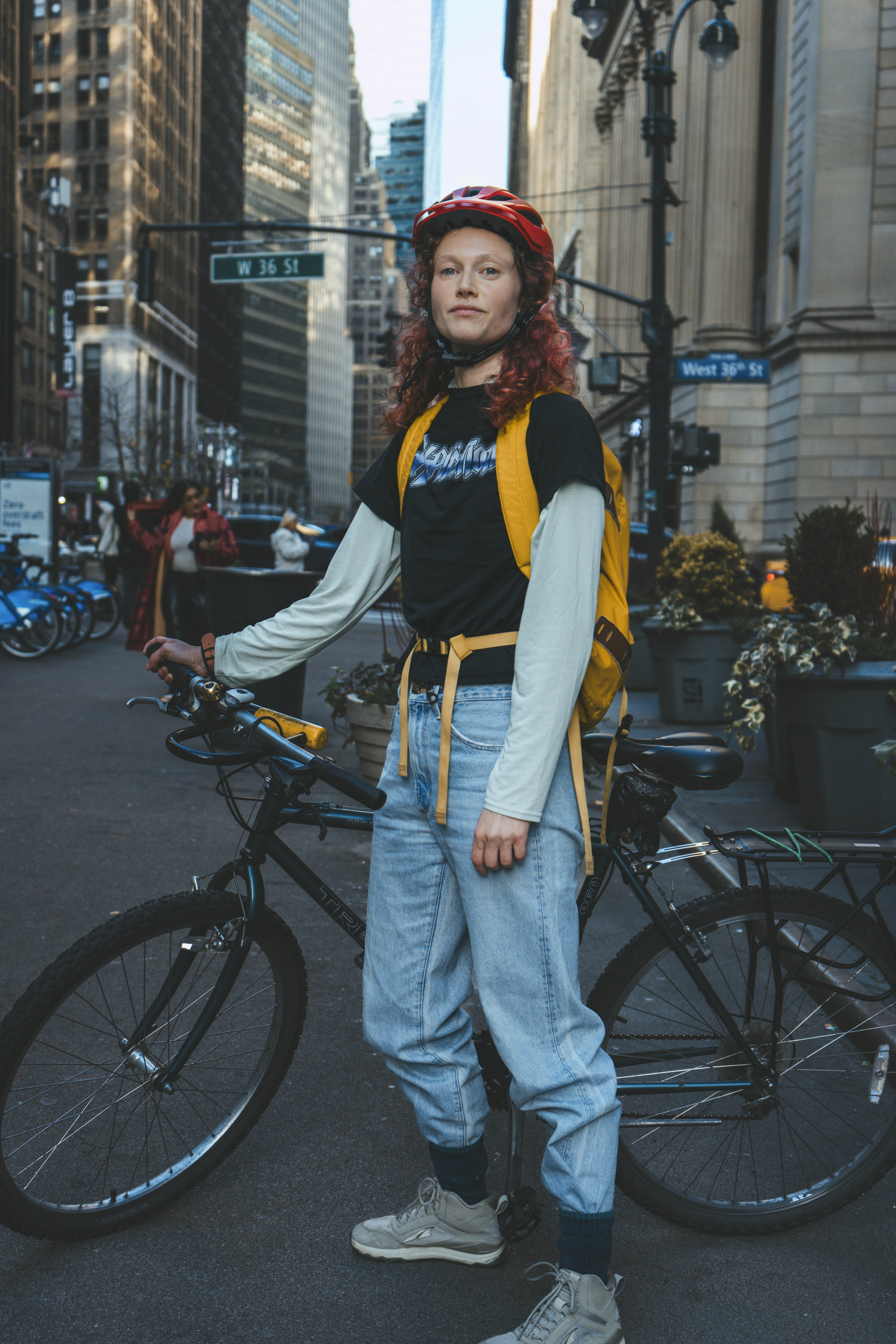 Woman looking thoughtfully out a window, holding a mug, suggesting introspection and a need for quiet time during her menstrual cycle.