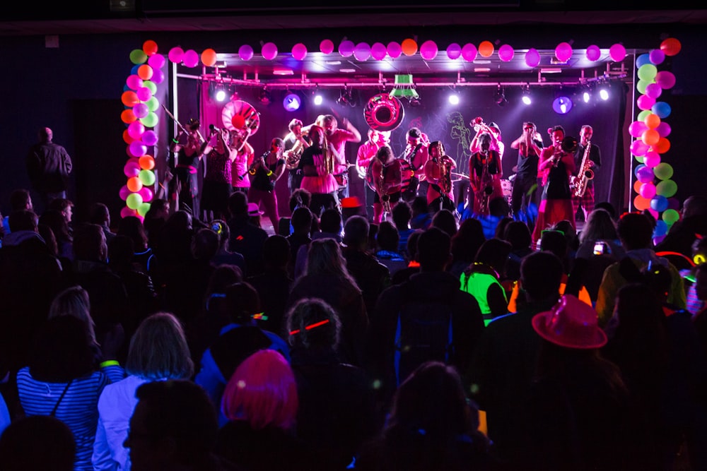 a group of people standing on top of a stage