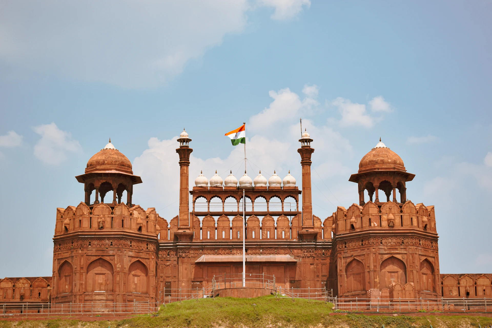 a large brick building with a flag on top of it