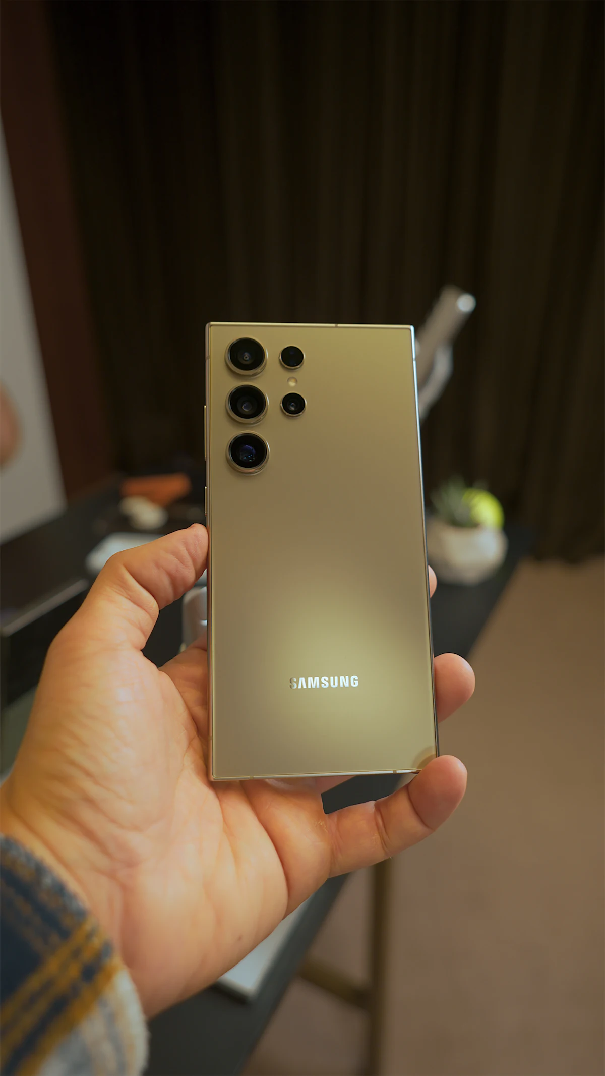 A person holding a Samsung Galaxy Android smartphone.