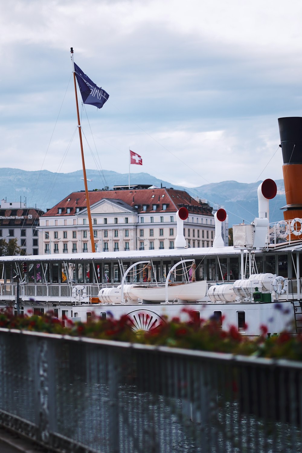 a boat docked in a harbor next to a building