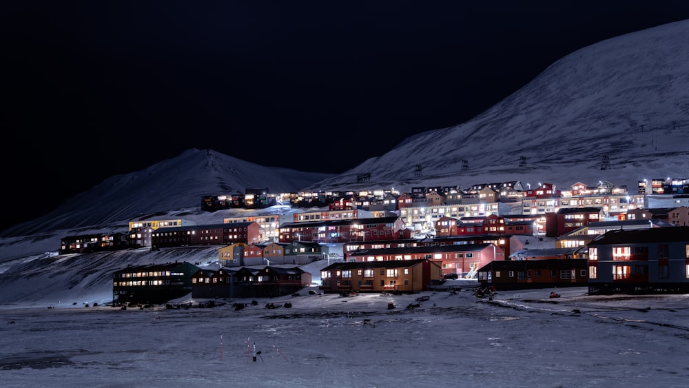a night view of a town in the mountains