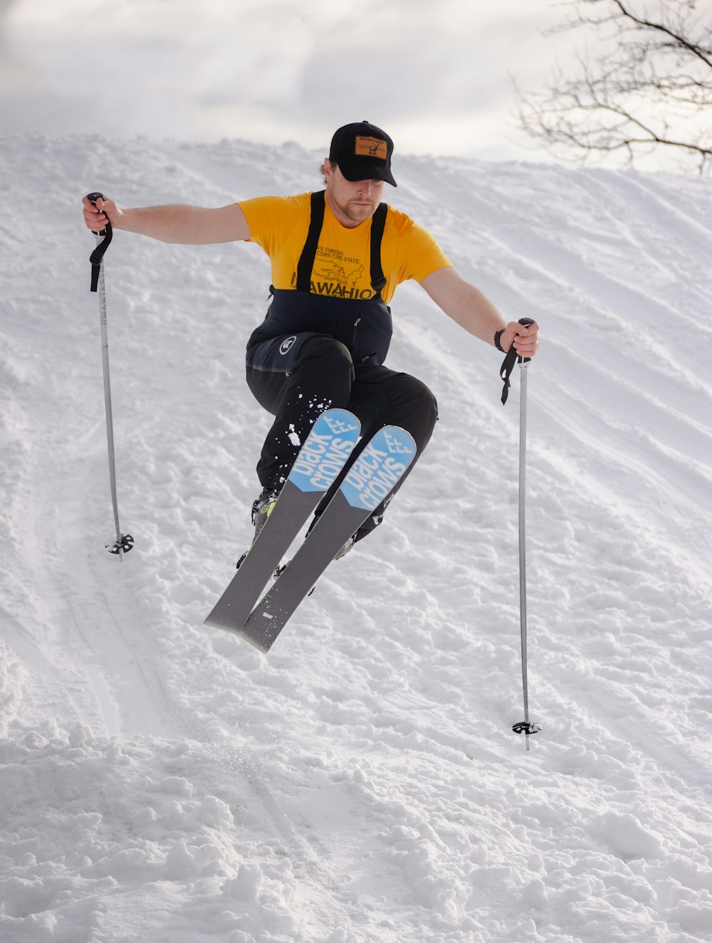 a man riding skis down a snow covered slope