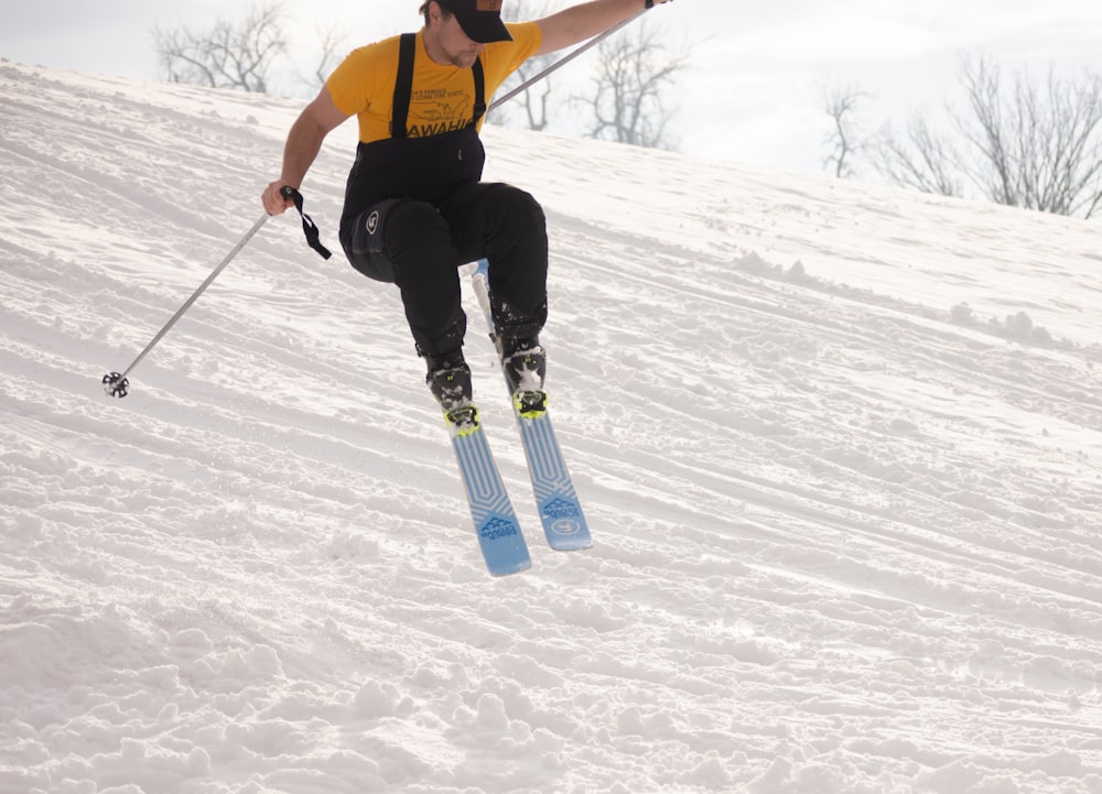 a man flying through the air while riding skis