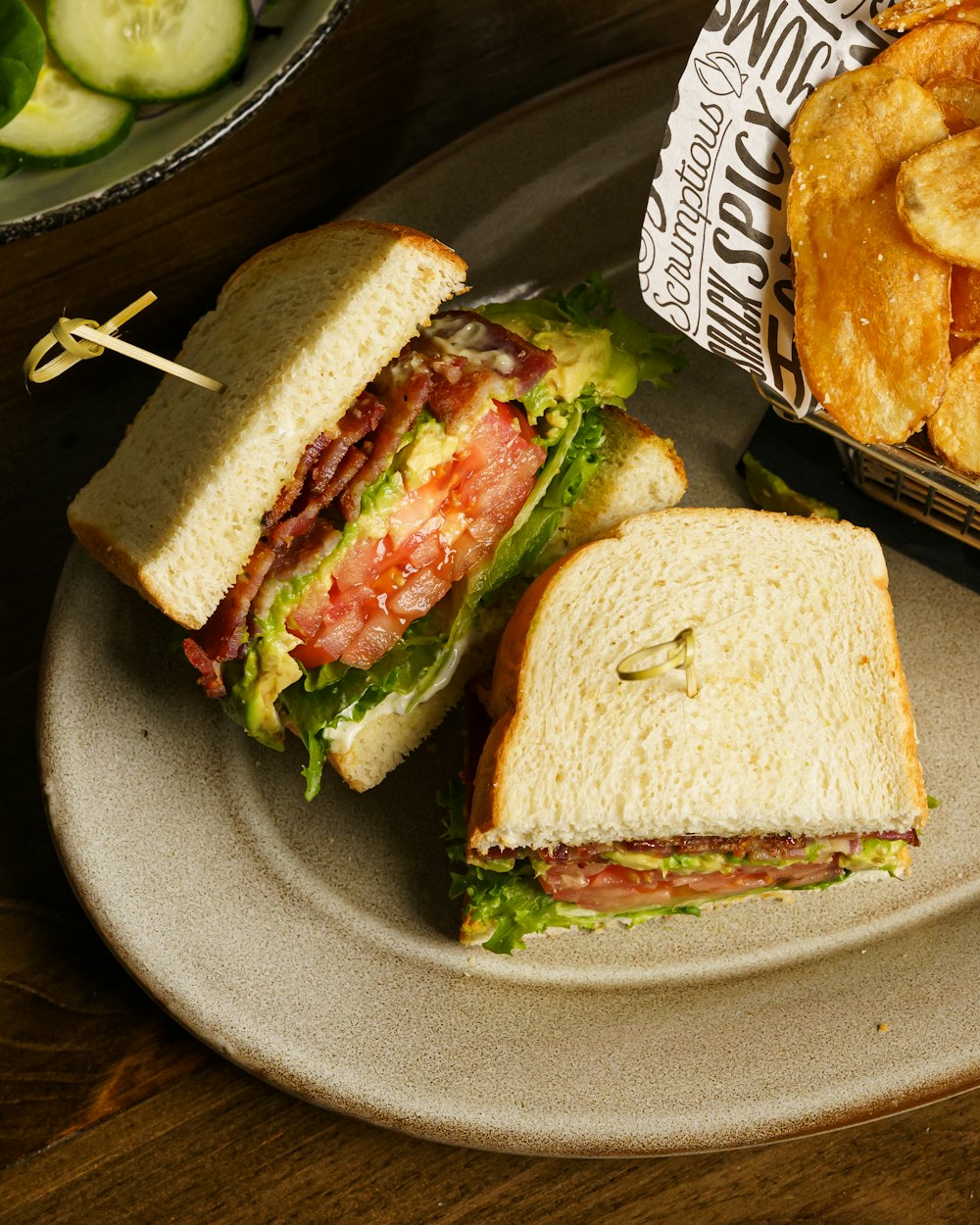 a sandwich and some onion rings on a plate