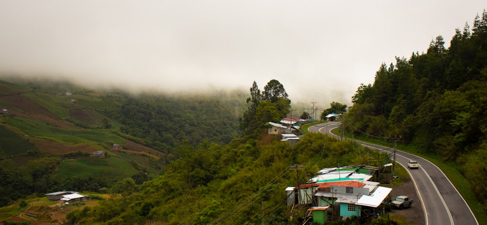 a road with a bunch of houses on the side of it