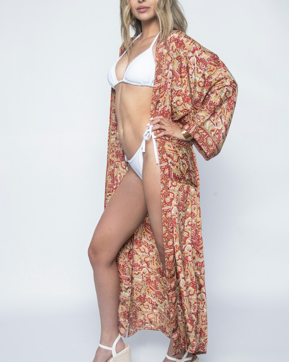 a woman in a bikini and kimono