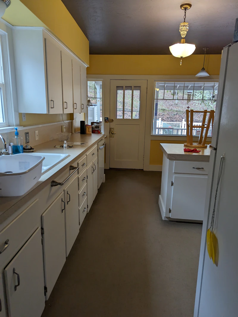 Old kitchen with outdated cabinets and appliances before remodel