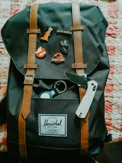 a backpack with a pair of scissors and a pair of scissors