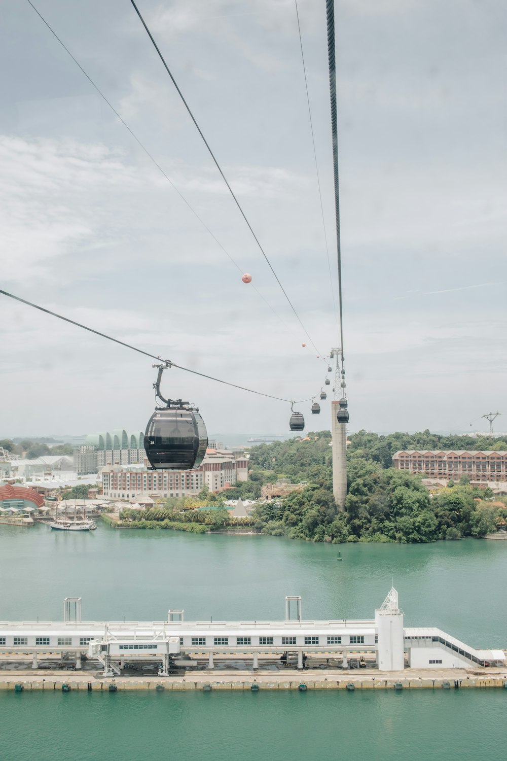 a cable car going over a body of water