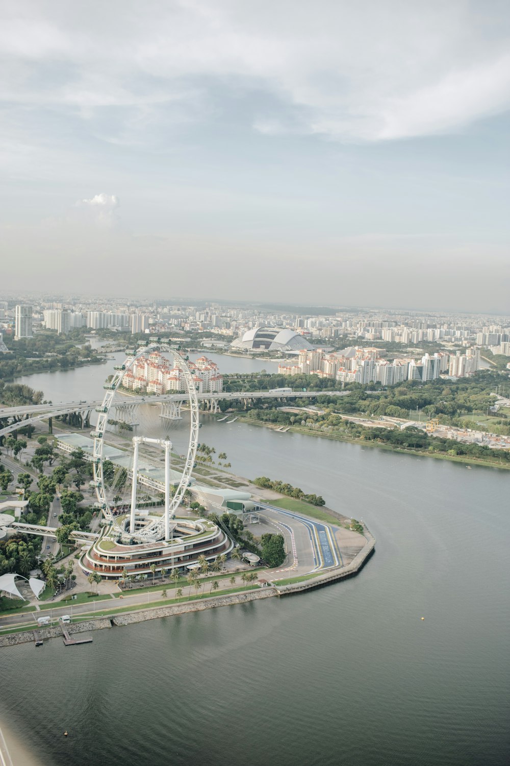 an aerial view of a ferris wheel in a city