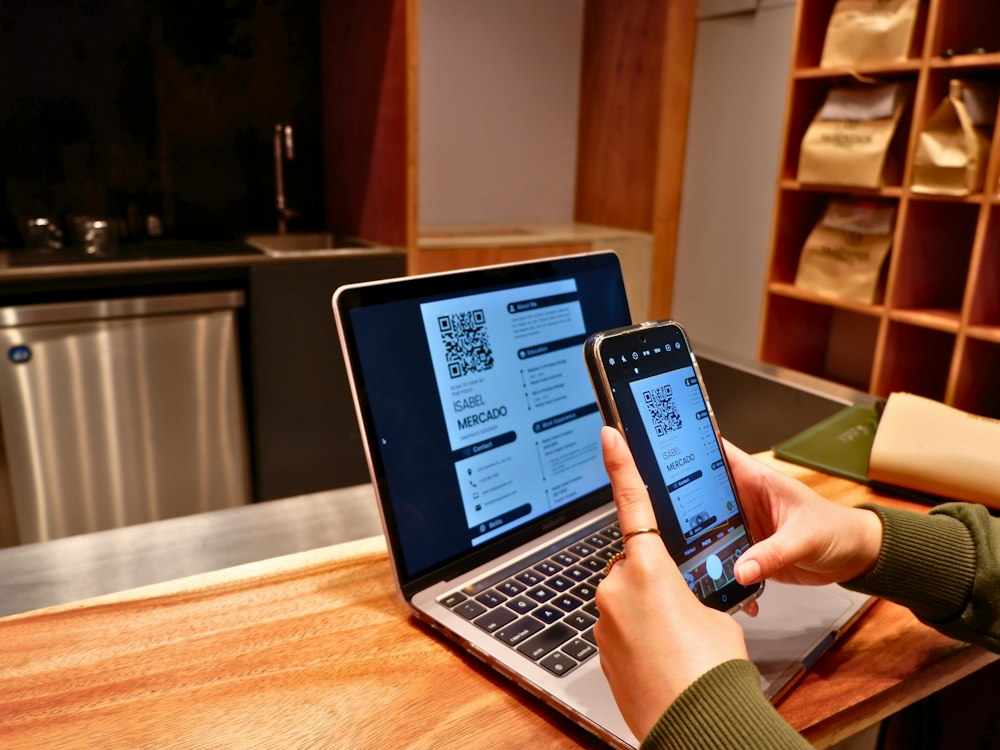 Laptop and phone on a desk while searching for jobs online