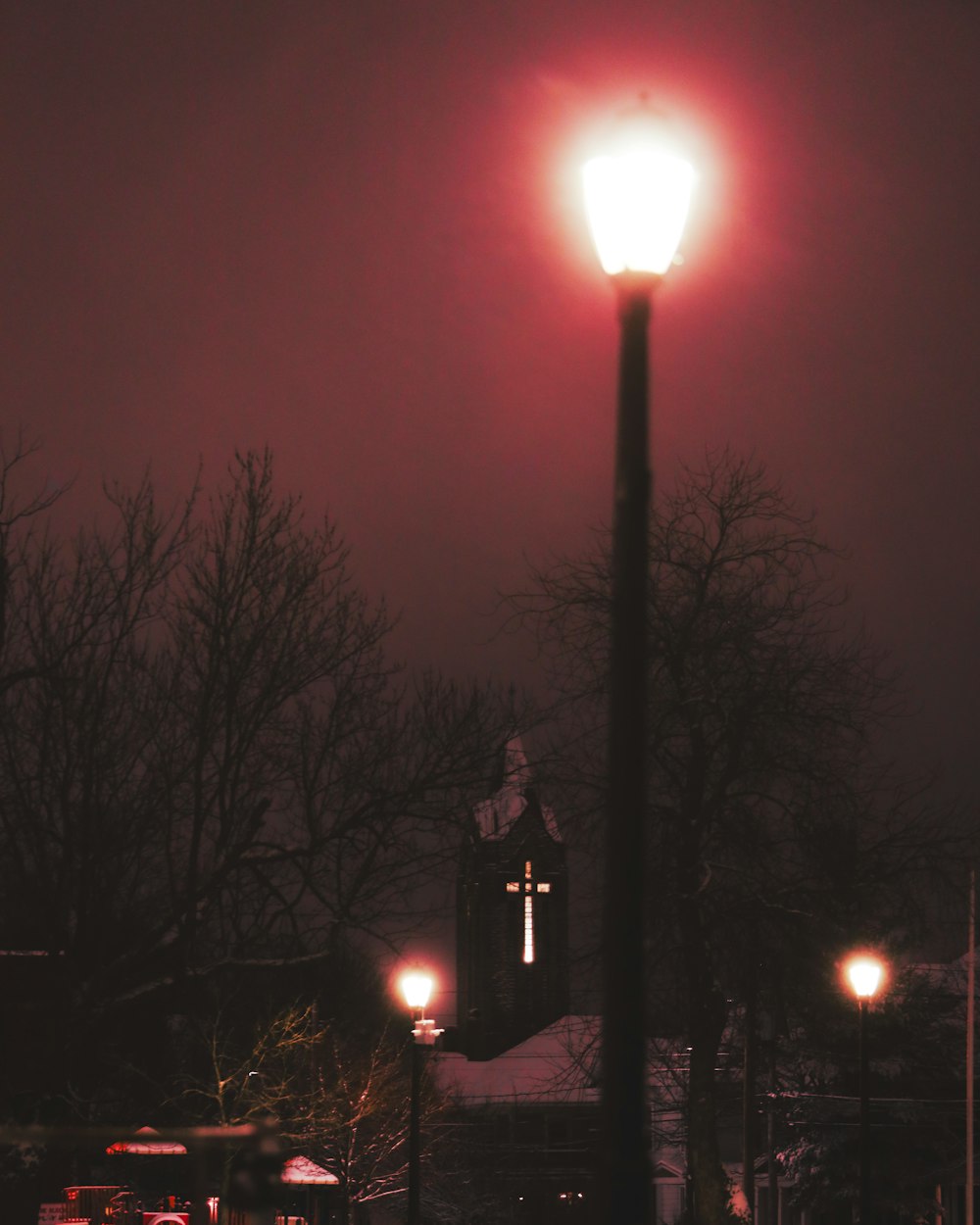 a street light on a dark street at night
