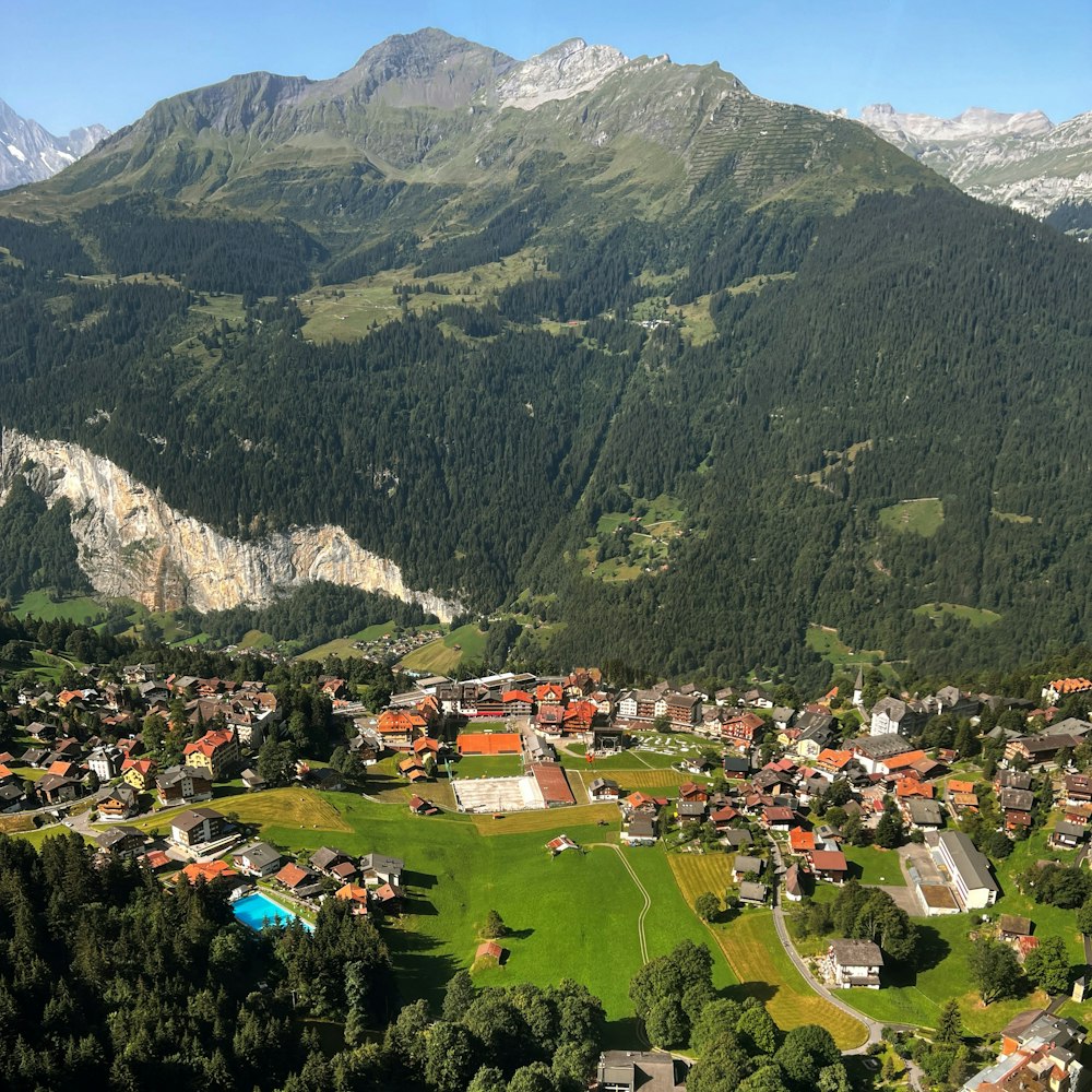 an aerial view of a village in the mountains