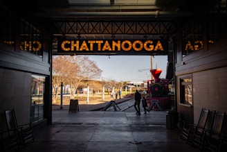 a train station with a train on the tracks