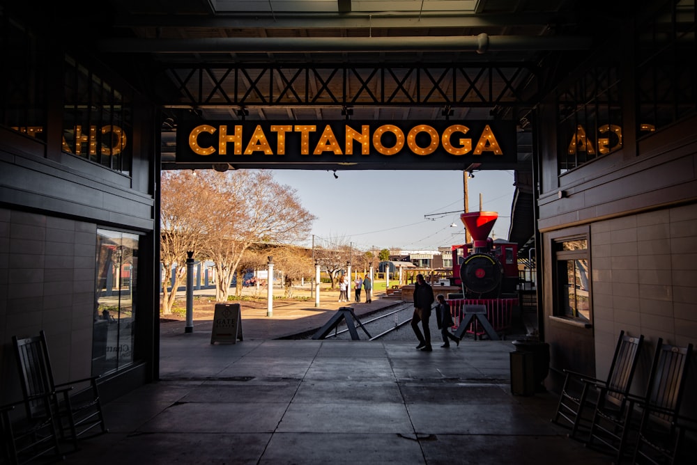 a train station with a train on the tracks