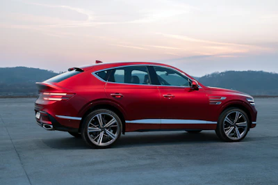 a red car parked in a parking lot
