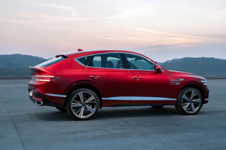 a red car parked in a parking lot