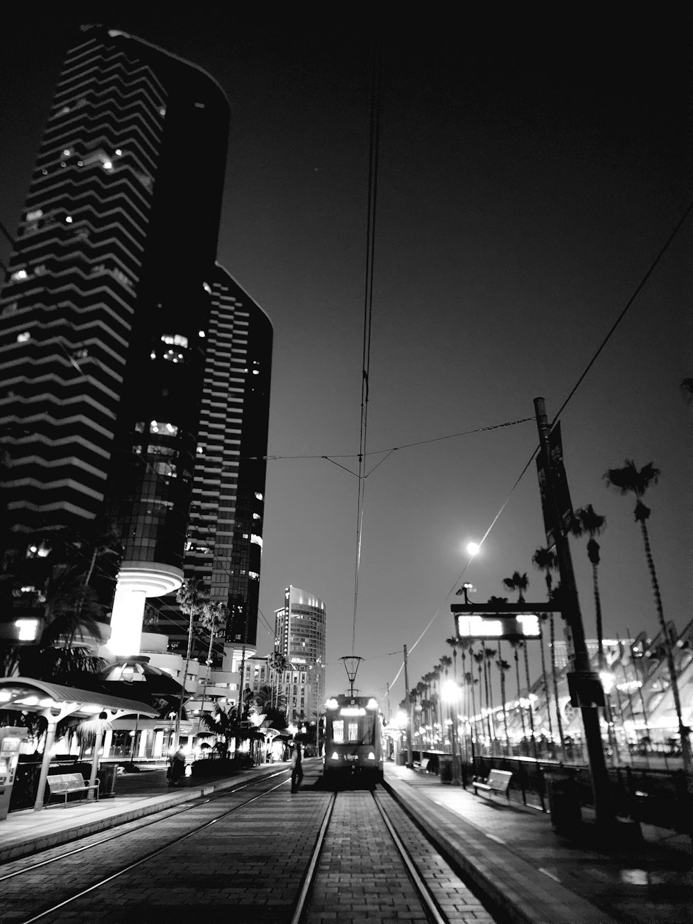 a black and white photo of a city at night