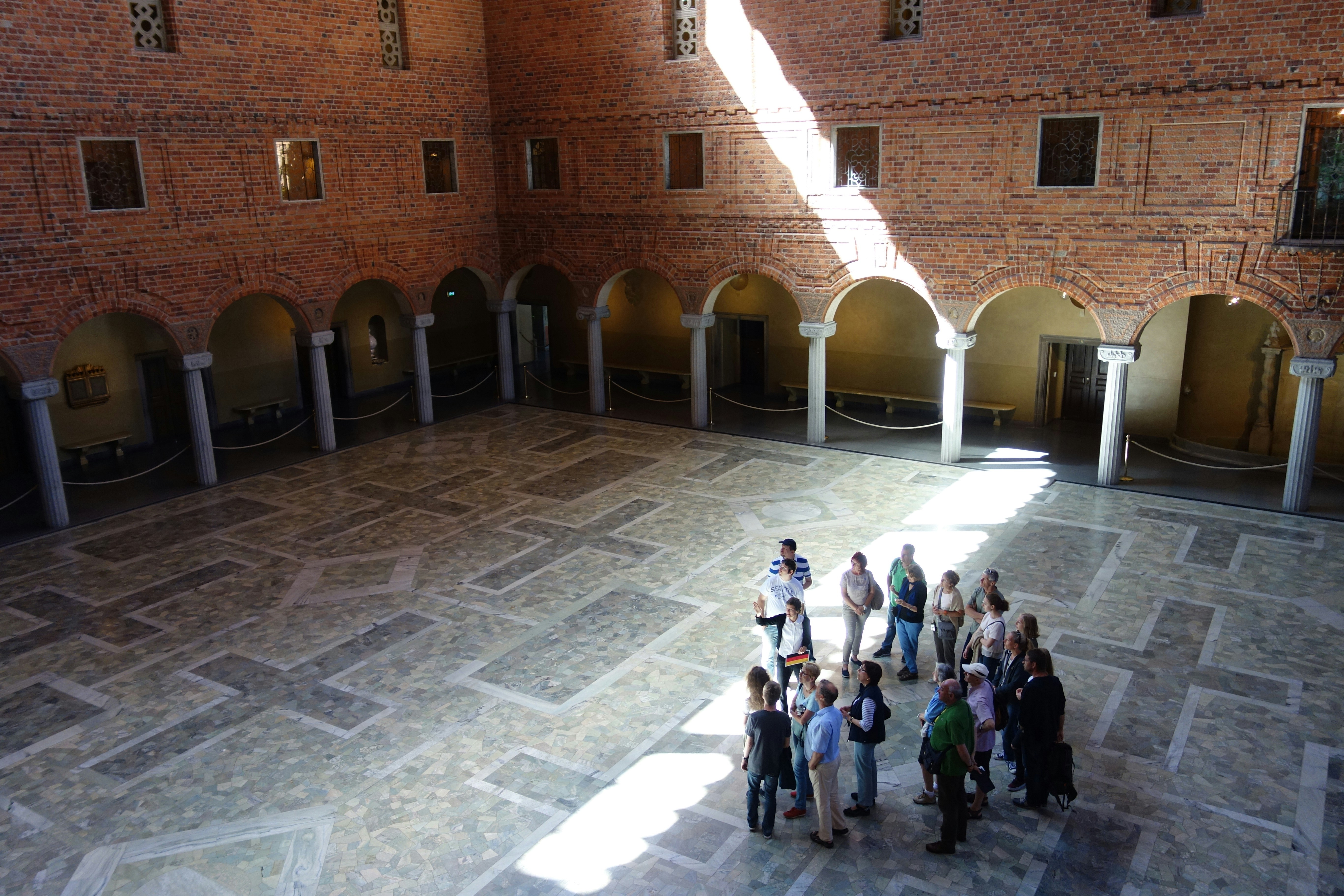 a group of people standing in a large room