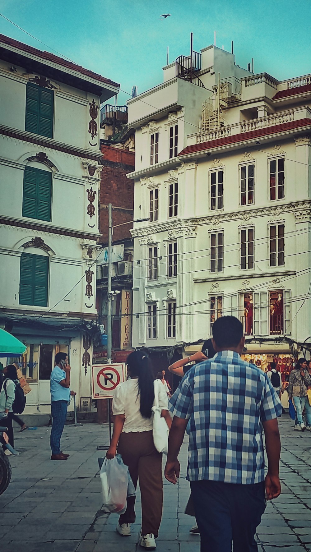 a man and a woman walking down a street