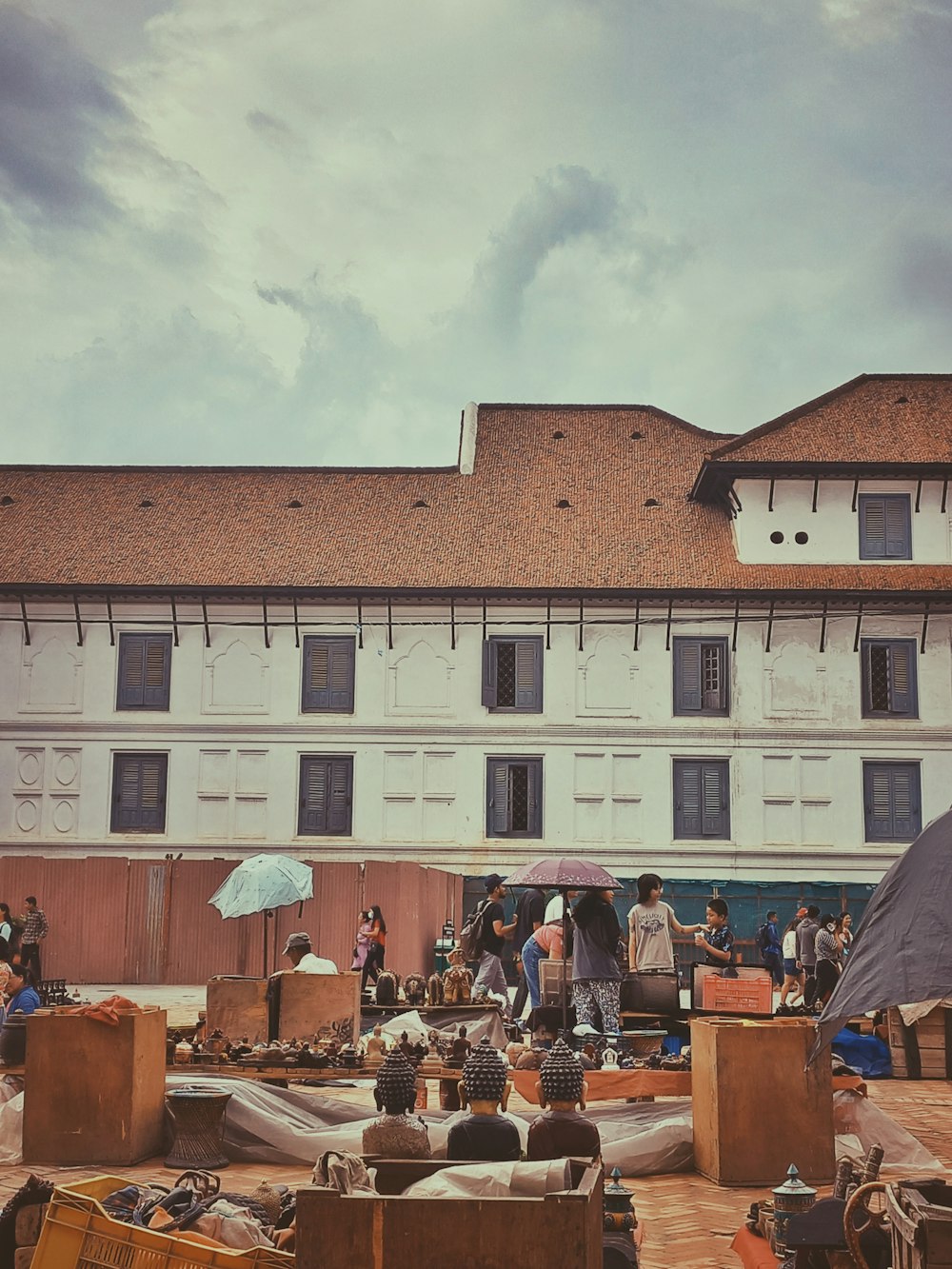 a group of people standing in front of a building