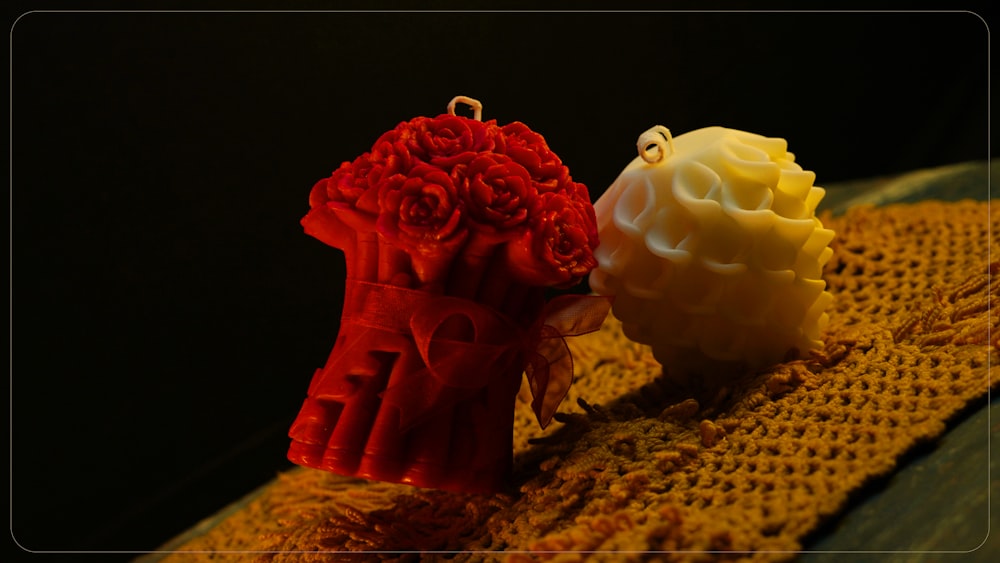 a couple of red and yellow items sitting on top of a table