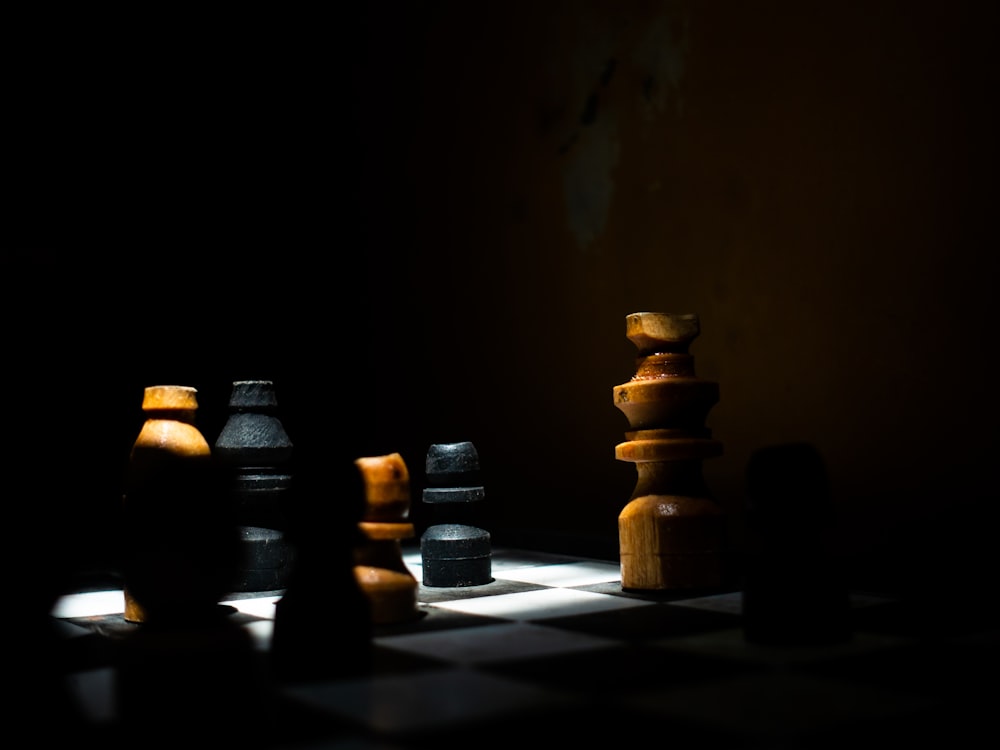 a group of chess pieces sitting on top of a chess board