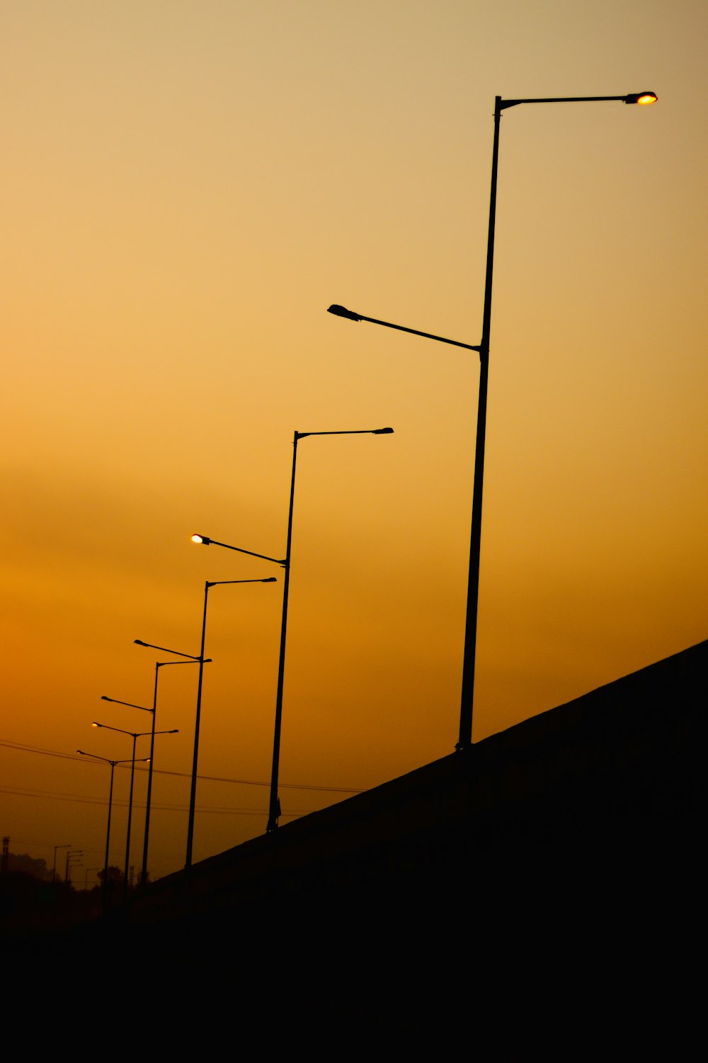 a row of street lights sitting next to each other