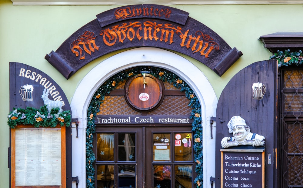 the entrance to a restaurant decorated for christmas