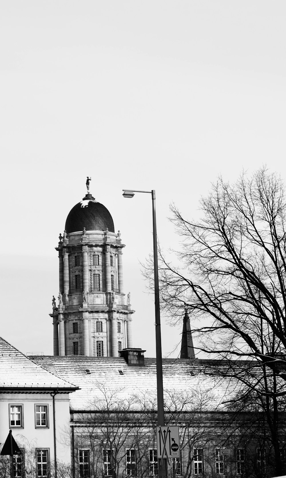 a black and white photo of a building with a clock tower