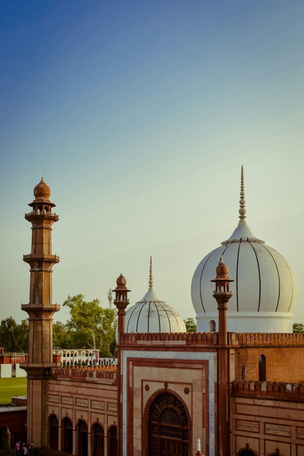 a large building with two white domes on top of it