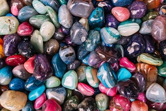 a pile of colorful rocks sitting next to each other