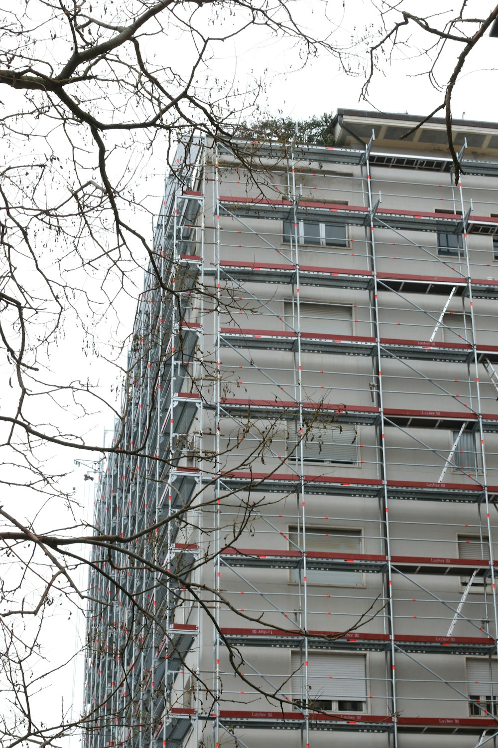 a tall building with scaffolding on the side of it