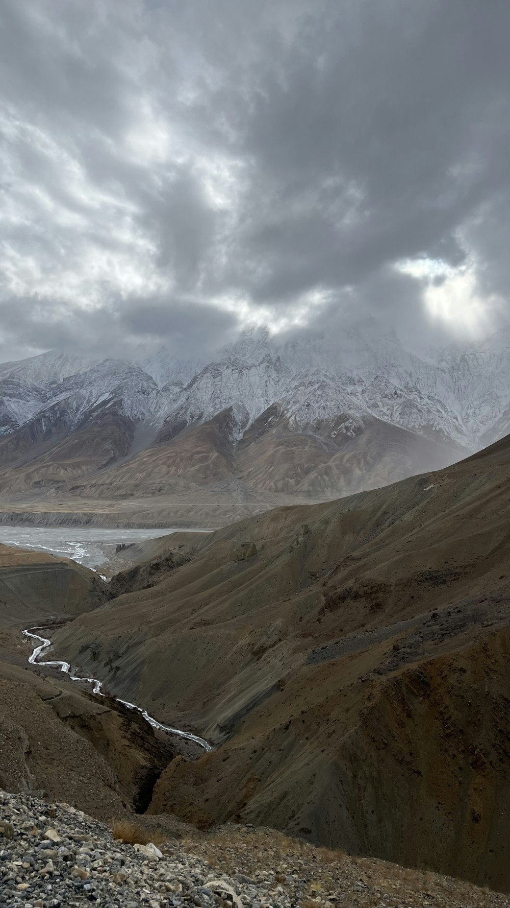 a view of a mountain range with a river running through it