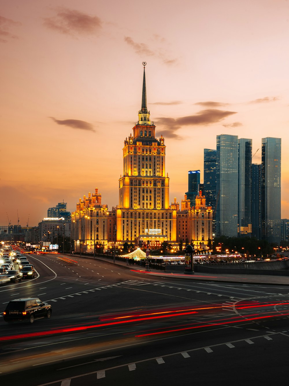 a very tall building with a spire in the middle of a city