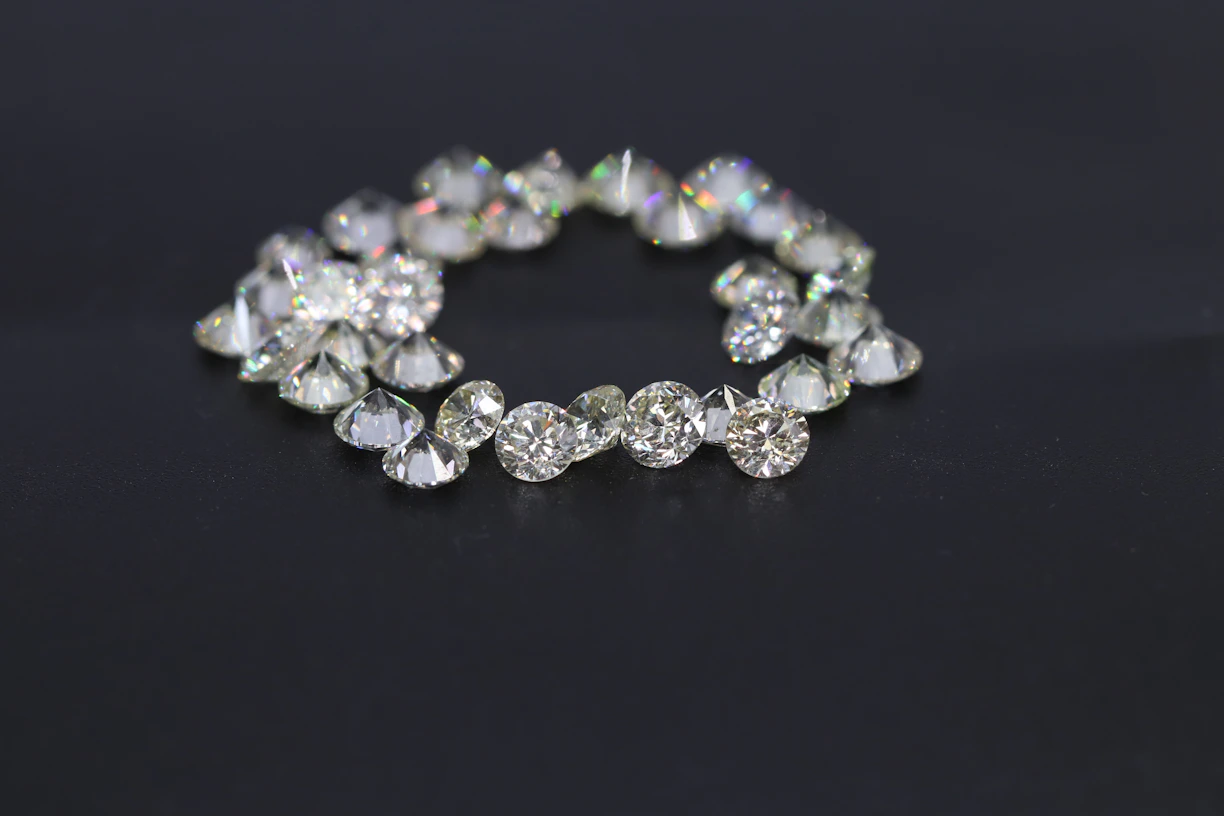 a diamond bracelet on a black surface