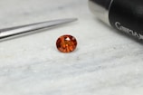 a close up of a diamond near a pair of scissors