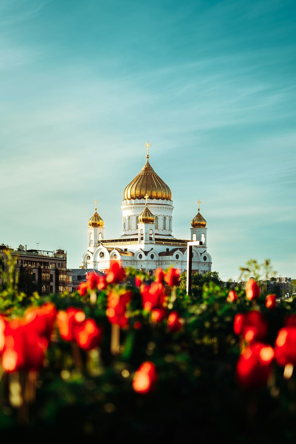 a large white building with a golden roof