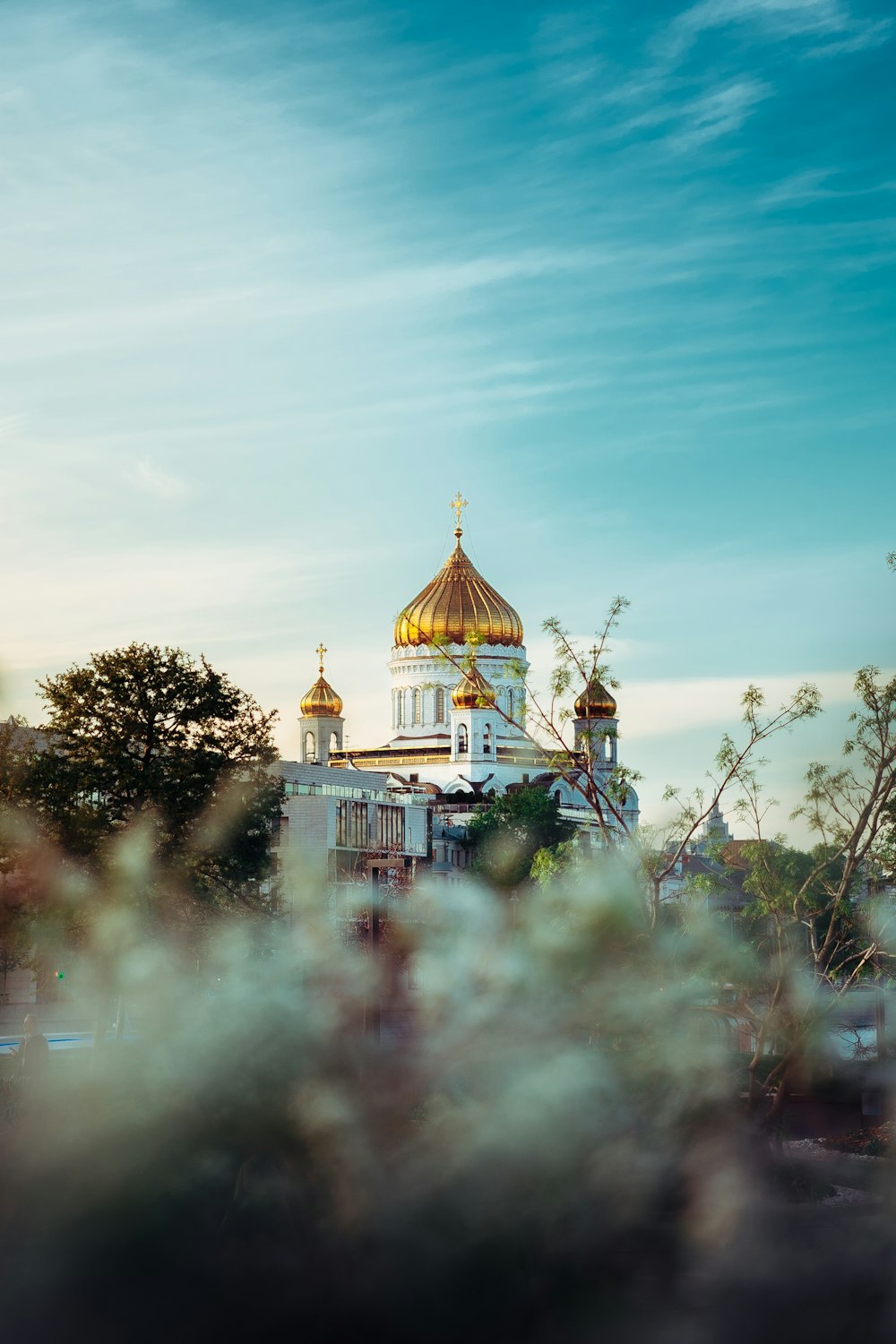 a large white building with a golden dome