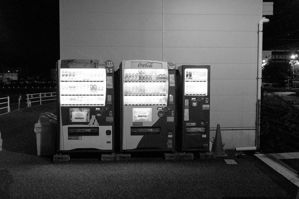 a couple of vending machines sitting next to each other