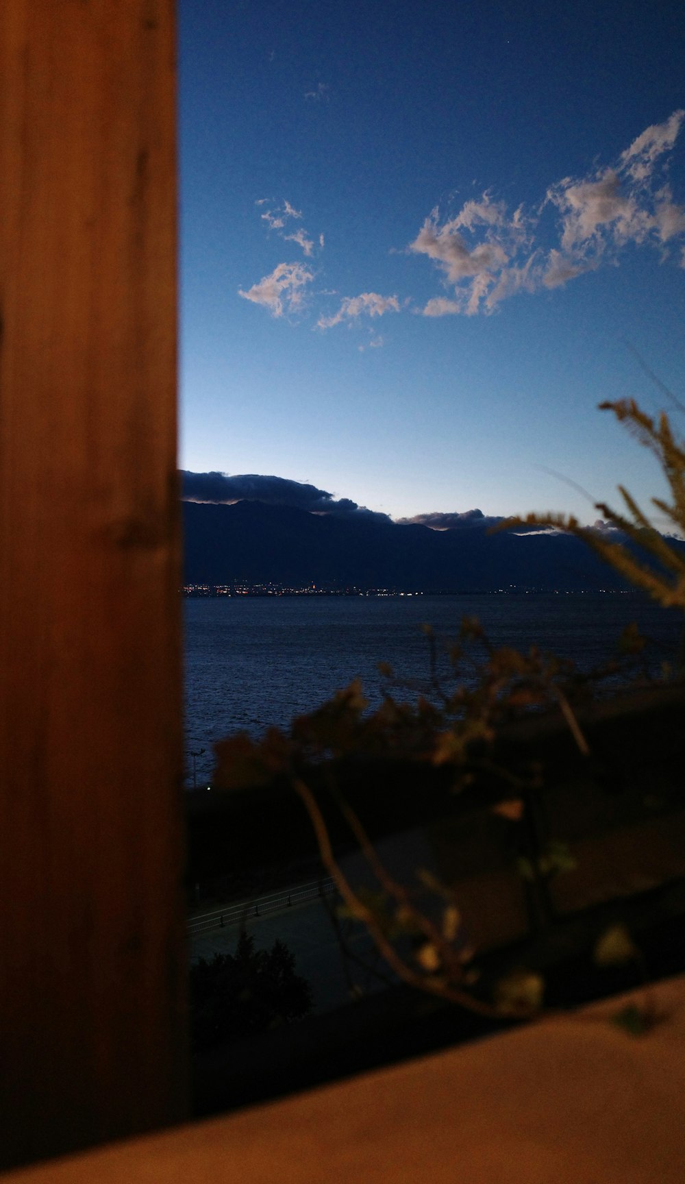 a view of a body of water with mountains in the background