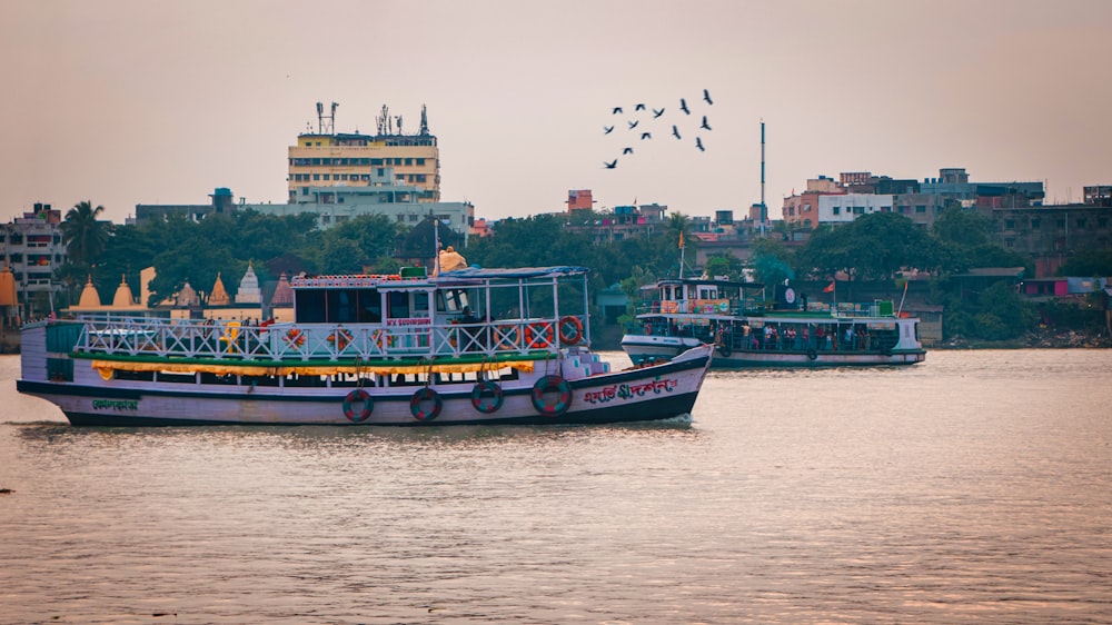 a group of boats floating on top of a river