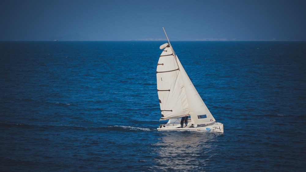 a sailboat sailing across a large body of water