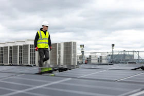 a man standing on top of a roof