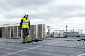 a man standing on top of a roof