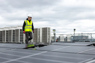 a man standing on top of a roof