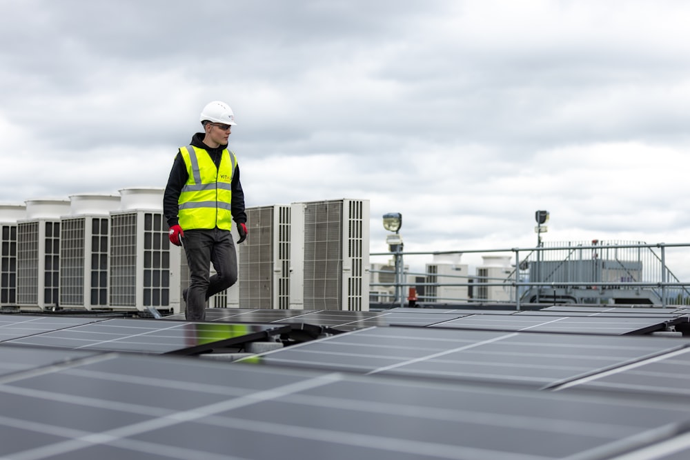 a man standing on top of a roof