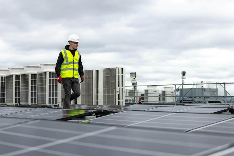 Technician walking a rooftop plant deck of air-handling units