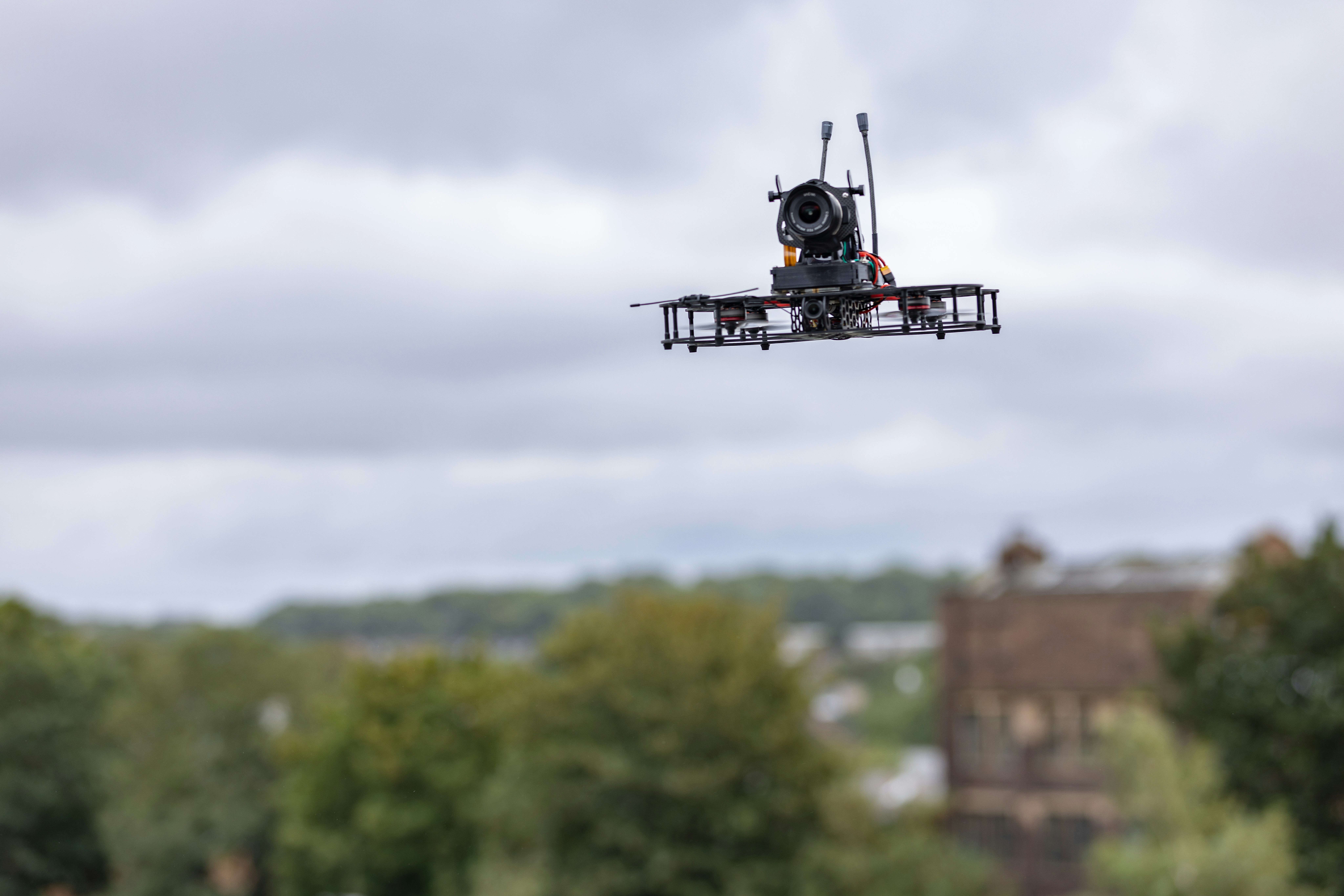 a black and white photo of a flying device